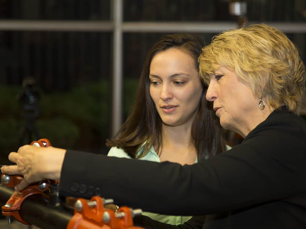 Susan Schierwagen, Victaulic Vice President for Coupling & Fire Suppression Systems, working with female engineering student