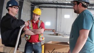 Three Workers Discussing a Project with Victaulic Products