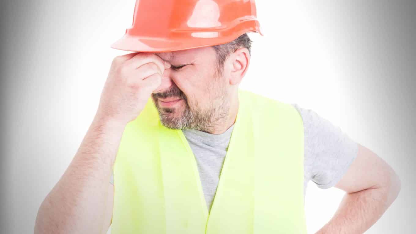 Portrait of male constructor forgot to do something as blooper or failure concept isolated on white with copy space area