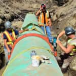 Workers working on a pipeline in Black Mountain - Victaulic