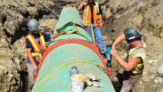 Workers working on a pipeline in Black Mountain - Victaulic