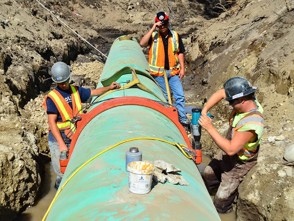 Workers working on a pipeline in Black Mountain - Victaulic