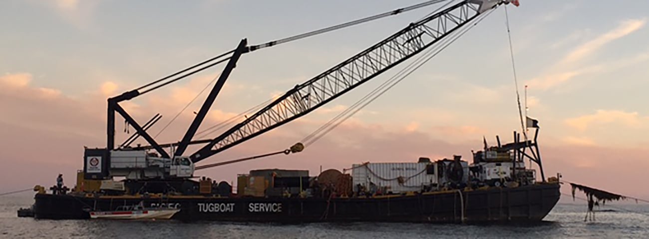 Tug Boat carrying equipment and supplies for the project