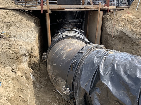 Installed large diameter coupling on wastewater discharge pipeline
