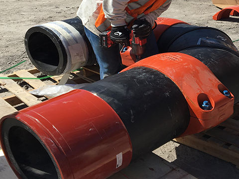 Installer joining HDPE coupling to fabricated HDPE pipe spool