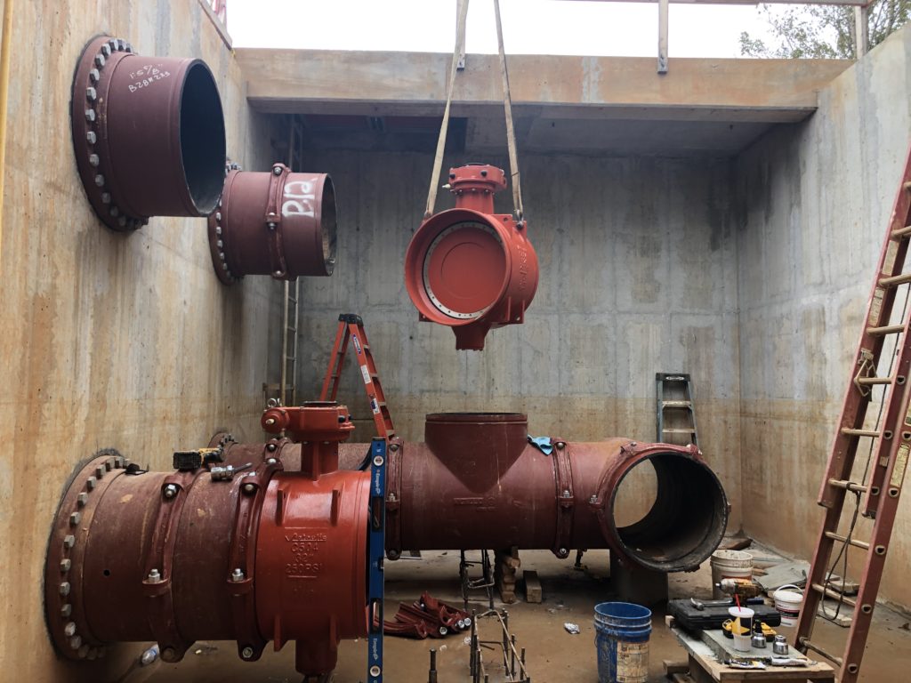 A Series W719 Butterfly Valve being lowered into the vault