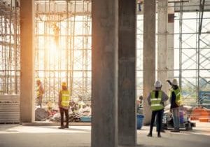 Construction engineers supervising progress of construction project